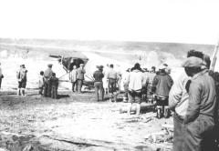 Crowd around first plane to arrive Herschel Island, summer 1929