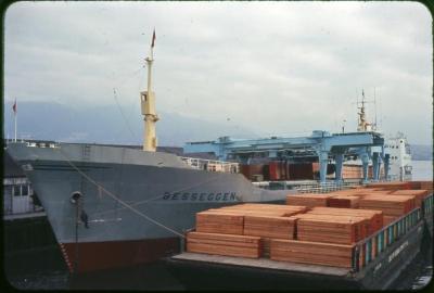 Port bow, at dock, loaded with lumber