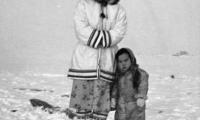 [Inuit] girl and young brother